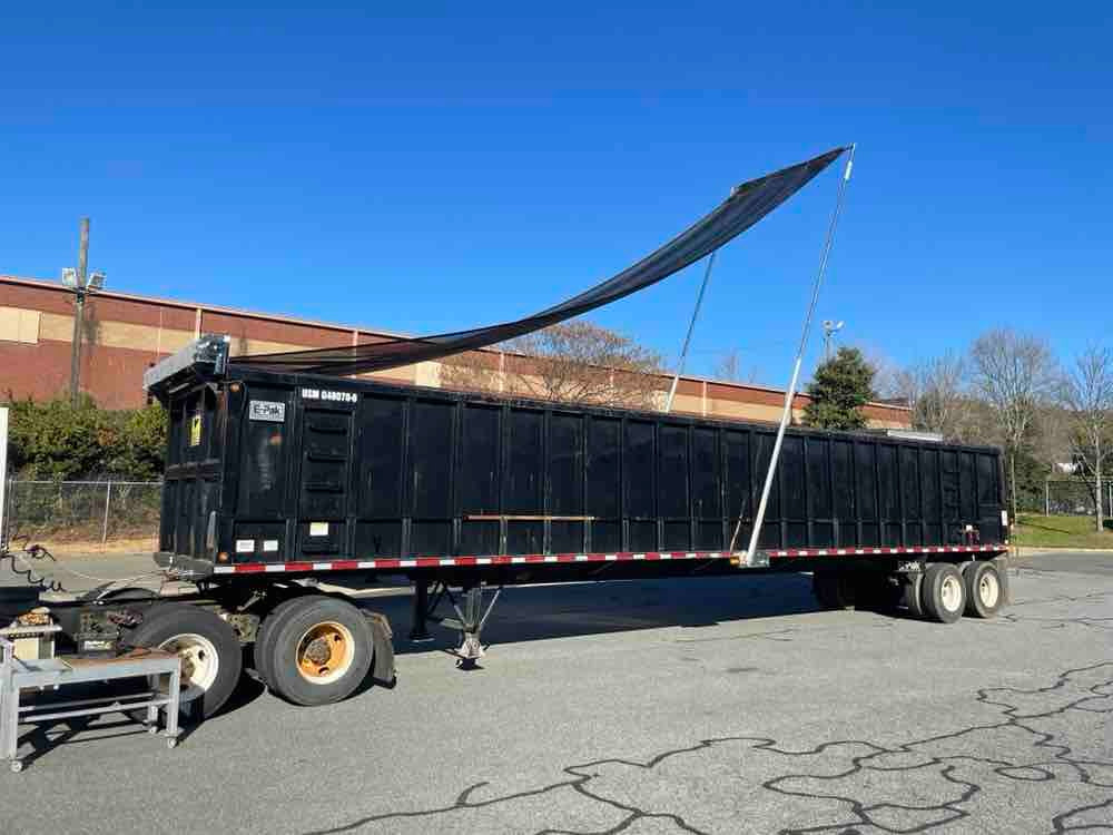Underbody Mounted Motorized Dump Truck System